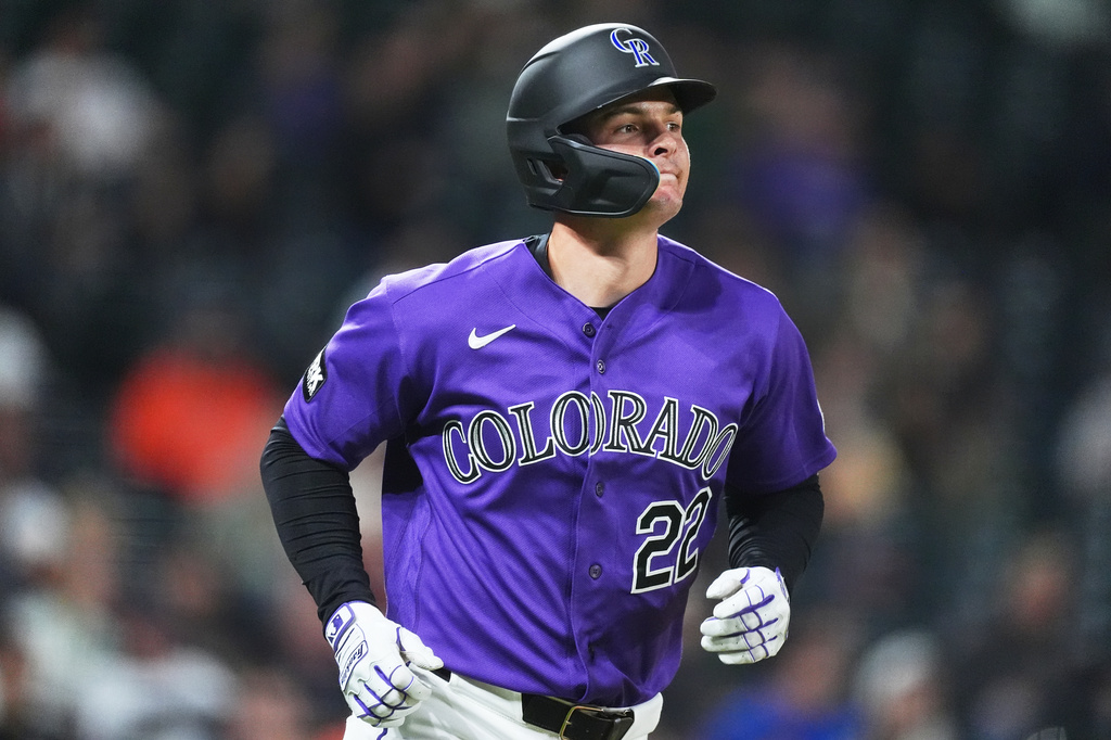 Colorado Rockies' Mickey Moniak heads up the first-base line after hitting a two-run home run off Houston Astros relief pitcher Kai-Wei Teng in the seventh inning of a baseball game Tuesday, April 7, 2026, in Denver. (AP Photo/David Zalubowski)