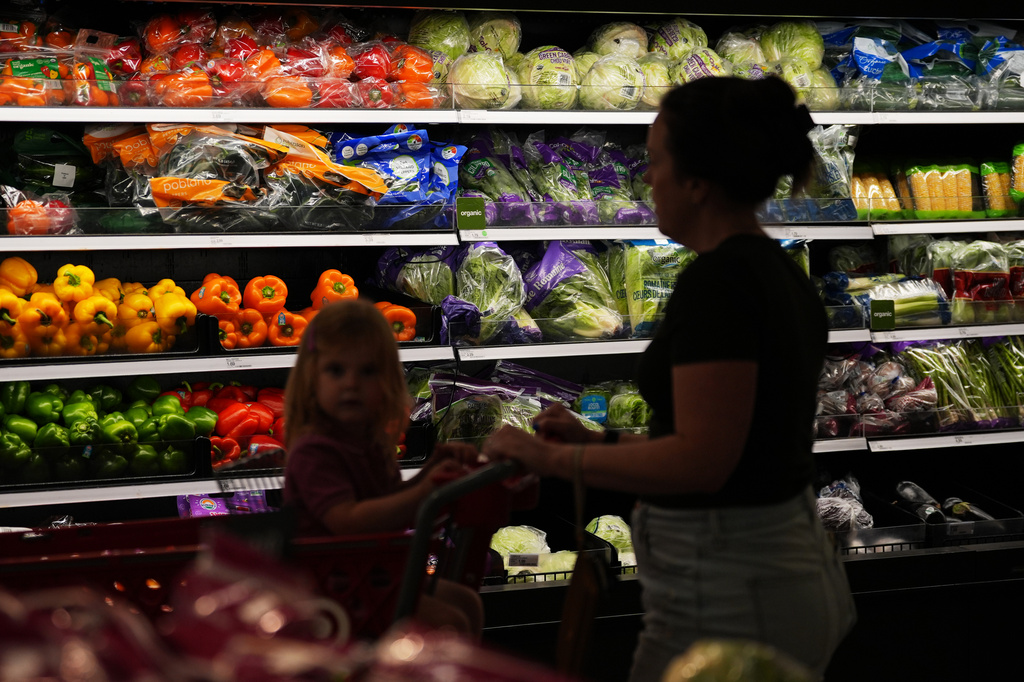 Shoppers browse the produce section at a Target store, Thursday, Aug. 13, 2026, in Woodbury, Minn. (AP Photo/Ellen Schmidt)
