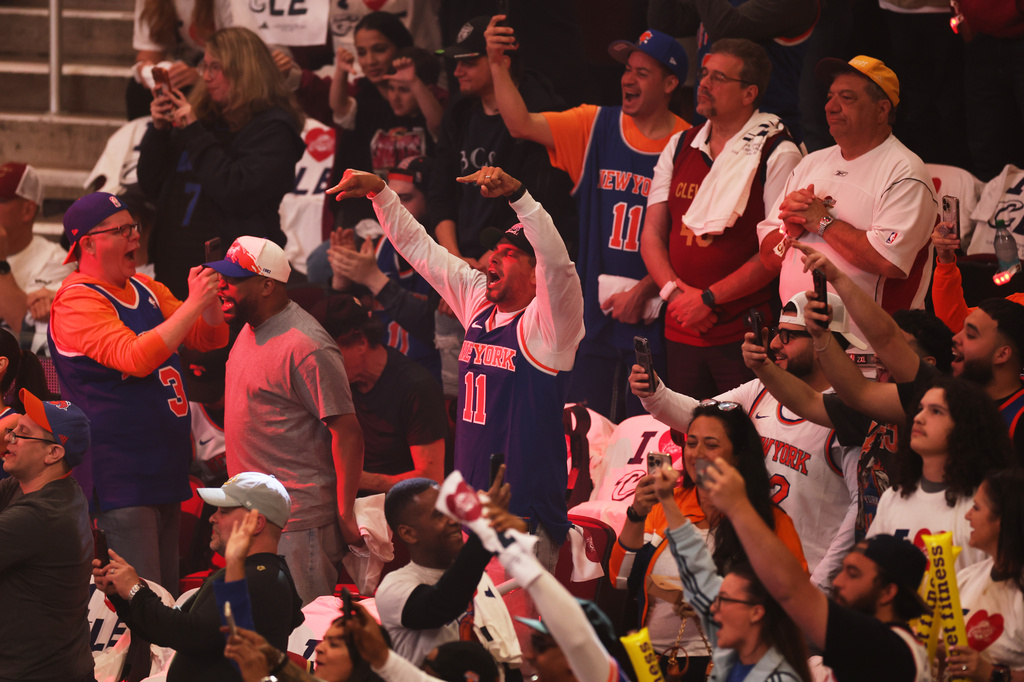 Fans cheer during the first half of Game 4 in the Eastern Conference finals NBA basketball playoffs series between the New York Knicks and the Cleveland Cavaliers in Cleveland, Monday, May 25, 2026. (AP Photo/Tim Phillis)