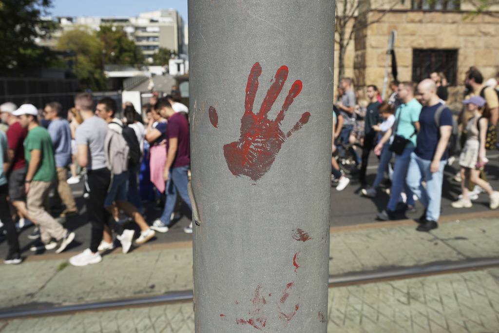 Led by university students, people attend a protest against increasing police brutality in Belgrade, Serbia, Monday, Sept. 8, 2025. (AP Photo/Darko Vojinovic)