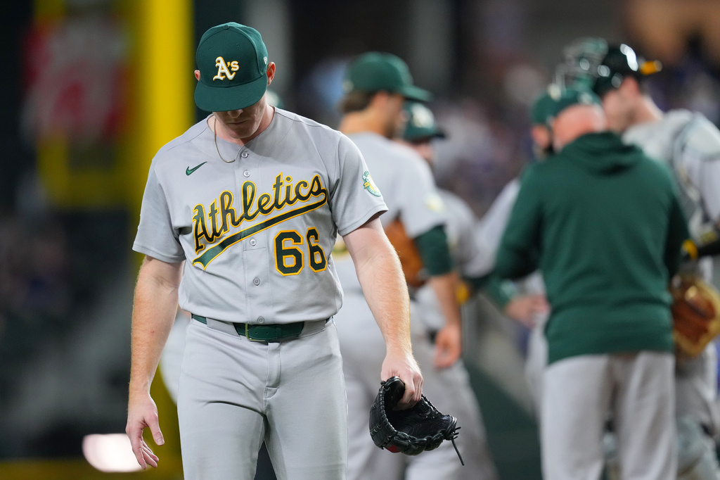 Athletics starting pitcher Brady Basso leaves the field after being pulled from the mound during the third inning of a baseball game against the Texas Rangers, Tuesday, Sept. 1, 2026, in Arlington, Texas. (AP Photo/Julio Cortez)