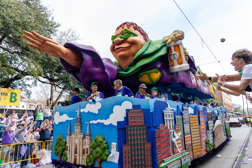 Attendees march during the annual Krewe of Tucks parade during the Mardi Gras season on Saturday, Feb. 14, 2026, in New Orleans. (Photo by Amy Harris/Invision/AP)
