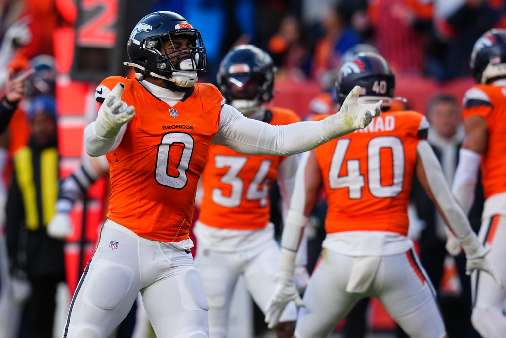 Denver Broncos linebacker Jonathon Cooper (0) celebrates after a fumble recovery during the second half of an NFL divisional round playoff football game against the Buffalo Bills, Saturday, Jan. 17, 2026, in Denver. (AP Photo/Jack Dempsey)