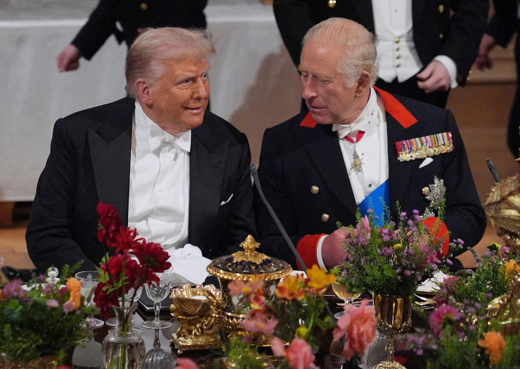 Britain's King Charles, right, and U.S. President Donald Trump speak at a State Banquet in Windsor Castle, England, on day one of U.S. President Donald Trump and First Lady Melania Trump's second state visit to the UK, Wednesday Sept. 17, 2025. (Yui Mok/PA via AP, Pool Photo via AP)