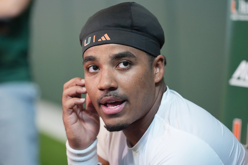 Miami quarterback Darian Mensah speaks following a team practice session at their training facility, Tuesday, Aug. 4, 2026, in Coral Gables, Fla. (AP Photo/Marta Lavandier)