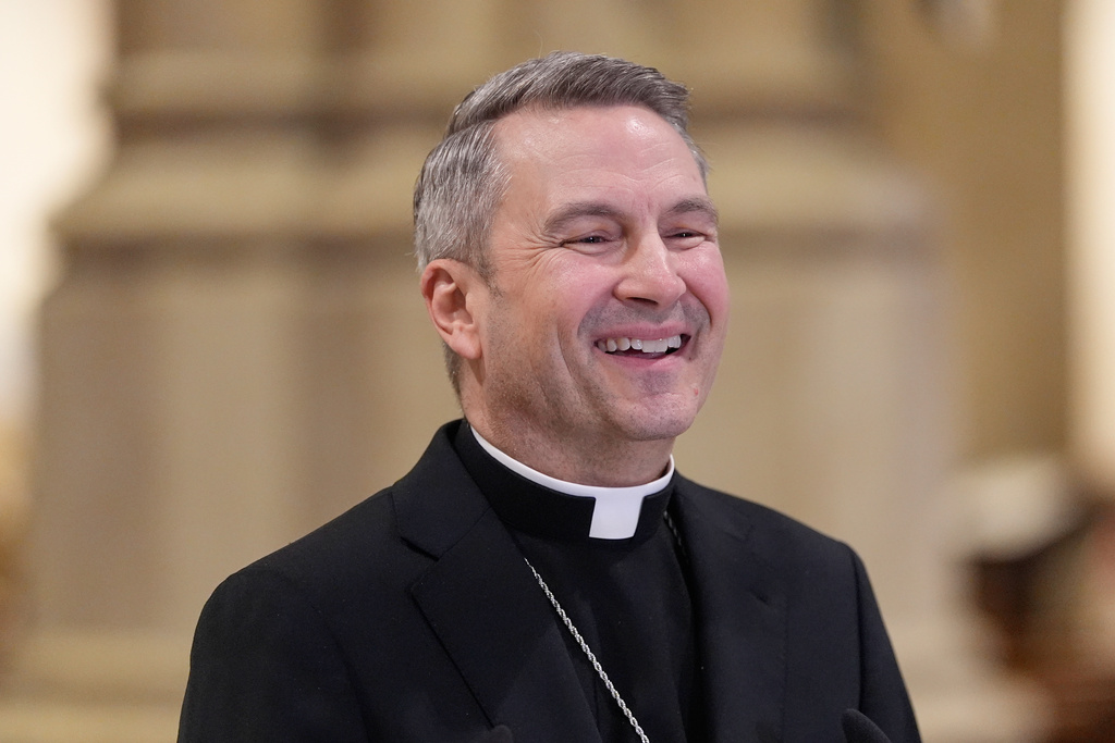 Archbishop-designate Ronald Hicks laughs during a news conference at St. Patrick's Cathedral in New York, Thursday, Feb. 5, 2026. (AP Photo/Seth Wenig)