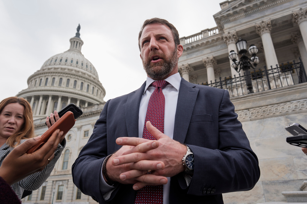 Sen. Markwayne Mullin, R-Okla., speaks with reporters on the steps at the Capitol in Washington, Thursday, March 5, 2026. (AP Photo/J. Scott Applewhite)