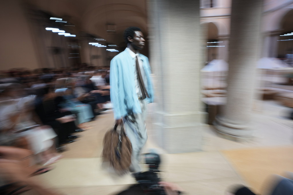 A model wears a creation as part of the Giorgio Armani Spring/Summer 2027 men's collection presented in Milan, Italy, Monday, June 22, 2026. (AP Photo/Luca Bruno)