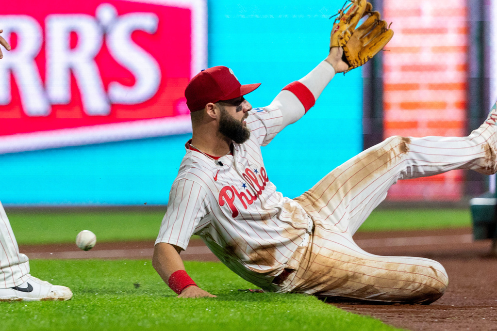Philadelphia Phillies left fielder Weston Wilson misses a foul ball from Miami Marlins' Eric Wagaman in the 11th inning of a baseball game, Tuesday, Sept. 23, 2025, in Philadelphia. (AP Photo/Laurence Kesterson)