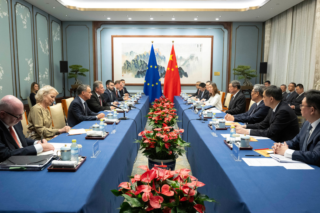 In this photo released by the Xinhua News Agency, Chinese Vice Premier He Lifeng, fourth right, meets with European Commissioner for Trade and Economic Security Maros Sefcovic, fourth left, in Beijing, Friday, Oct. 9, 2026. (Tian Yu/Xinhua via AP)