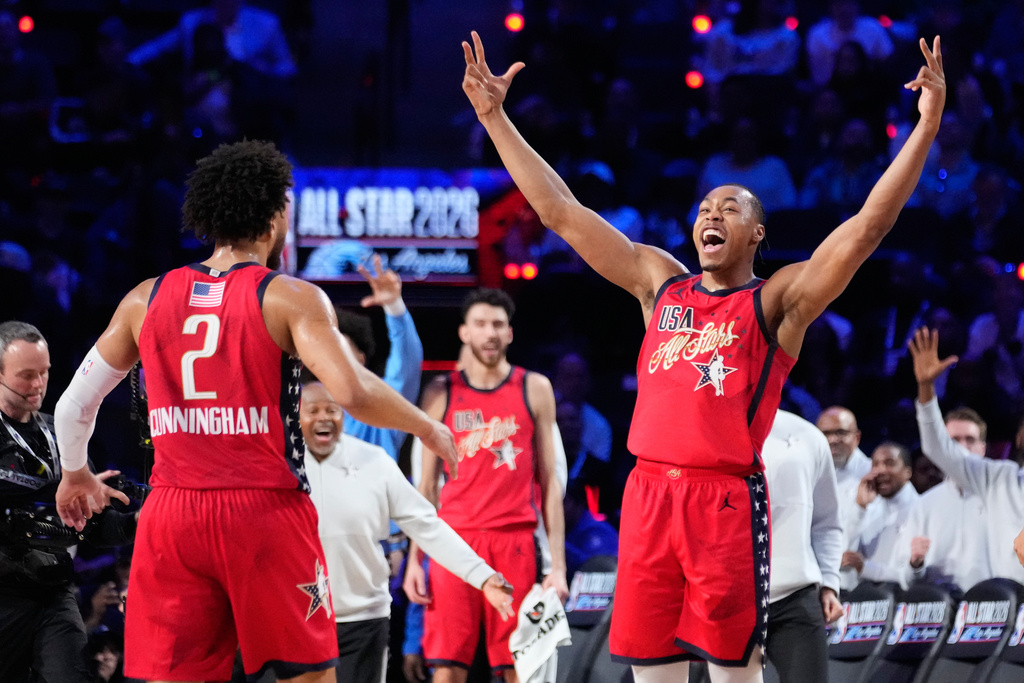 USA Stars forward Scottie Barnes, center, celebrates with guard Cade Cunningham after a win over World during the NBA All-Star basketball game Sunday, Feb. 15, 2026, in Inglewood, Calif. (AP Photo/Mark J. Terrill)