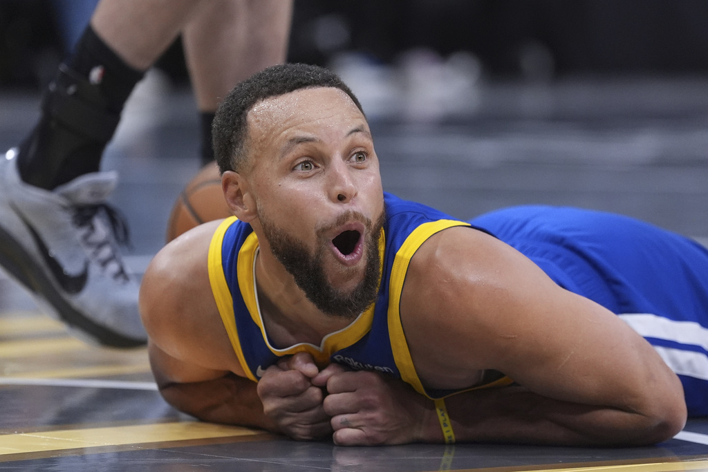 Golden State Warriors guard Stephen Curry (30) reacts after he was fouled during the second half of an NBA Cup basketball game against the San Antonio Spurs in San Antonio, Friday, Nov. 14, 2025. (AP Photo/Eric Gay)