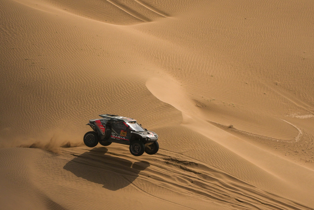 Driver Nasser Al-Attiyah and co-driver Fabian Lurquin compete during the twelfth stage of the Dakar Rally between Al Henakiyah and Yanbu, Saudi Arabia, Friday, Jan.16, 2026. (AP Photo/Thibault Camus)