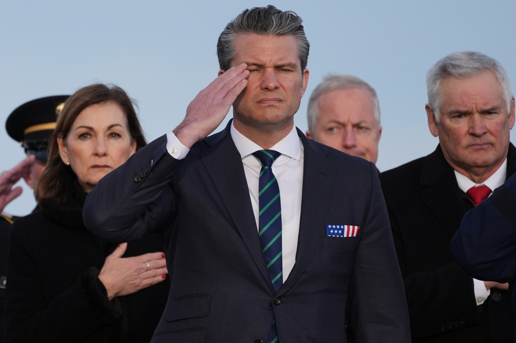 Defense Secretary Pete Hegseth salutes during a casualty return for Iowa National Guard soldiers Sgt. William Nathaniel Howard, 29, of Marshalltown, Iowa, and Sgt. Edgar Brian Torres-Tovar, 25, of Des Moines, Iowa, and civilian interpreter Ayad Mansoor Sakat, who were killed in Syria, Wednesday, Dec. 17, 2025, at Dover Air Force Base, Del. (AP Photo/Evan Vucci)