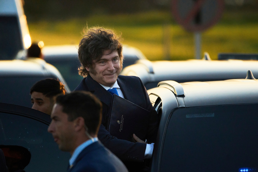 Argentina's President Javier Milei arrives at Ezeiza Prison Complex to present a draft reform of the criminal code to be sent to the Congress in Ezeiza, Argentina, Thursday, Oct. 2, 2025. (AP Photo/Rodrigo Abd)