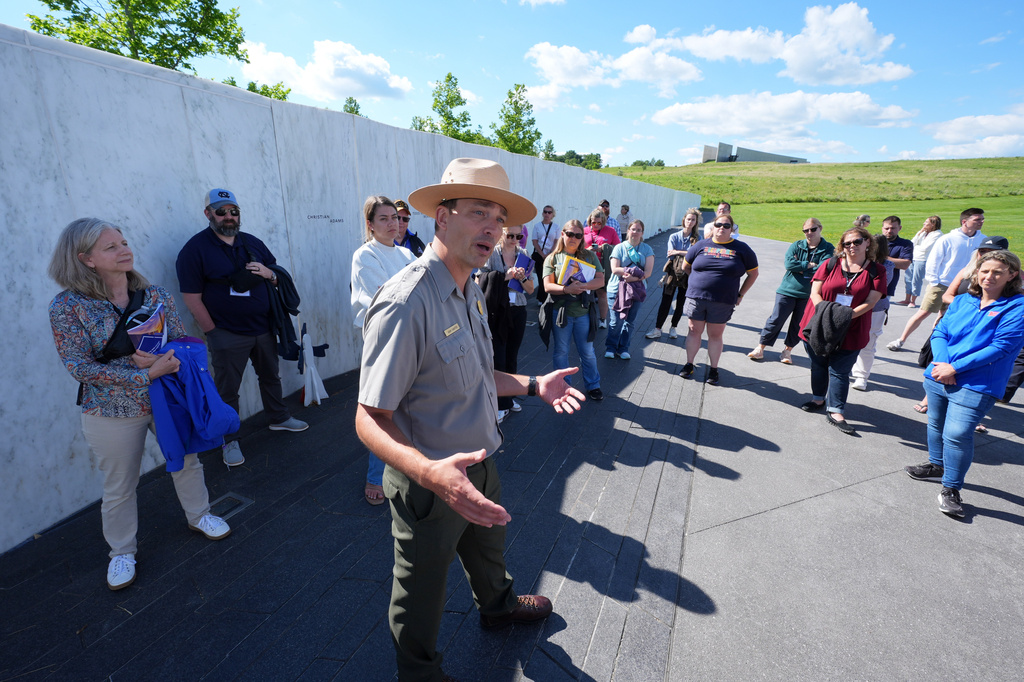 U.S. Park Ranger Adam Shaffer, center, leads a tour for a group of educators at the Flight 93 National Memorial in Shanksville, Pa., Tuesday, June 23, 2026. (AP Photo/Gene J. Puskar)