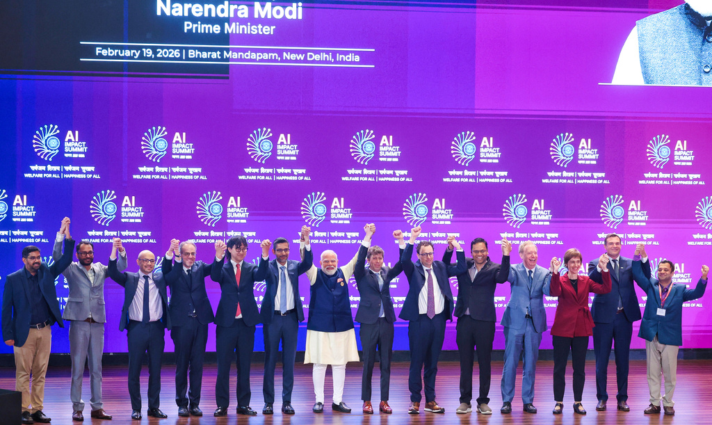 India's Prime Minister Narendra Modi, seventh left, poses for photographs with chief executive officers of various AI groups during the AI Summit in New Delhi, India, Thursday, Feb. 19, 2026. (Indian Prime Minister's Office via AP)