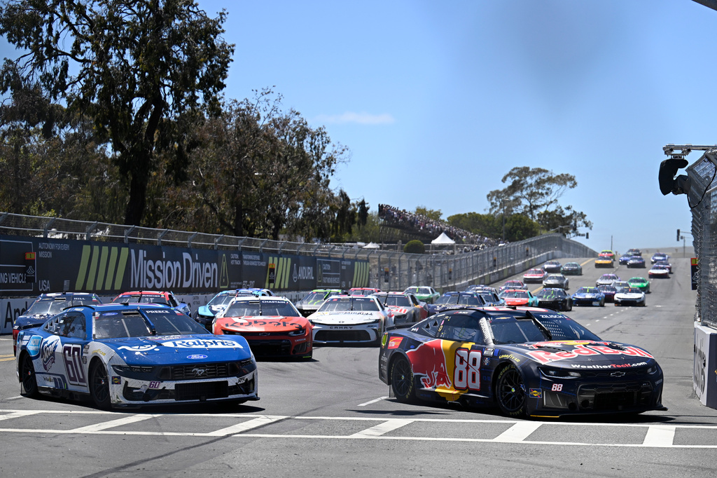 Connor Zilisch (88) and Ryan Preece (60) go around Turn 2 during a NASCAR Cup Series auto race, Sunday, June 21, 2026, in Coronado, Calif. (AP Photo/Denis Poroy)