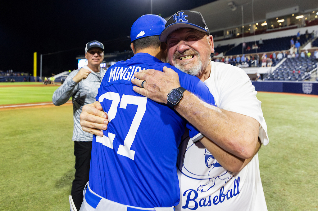 This photo provided by University of Kentucky Athletics shows Jackie McCloud, right, hugging Kentucky head coach Nick Mingione after winning an NCAA college baseball game March 20, 2026, in Oxford, Miss. (Cam Williams/University of Kentucky Athletics via AP)