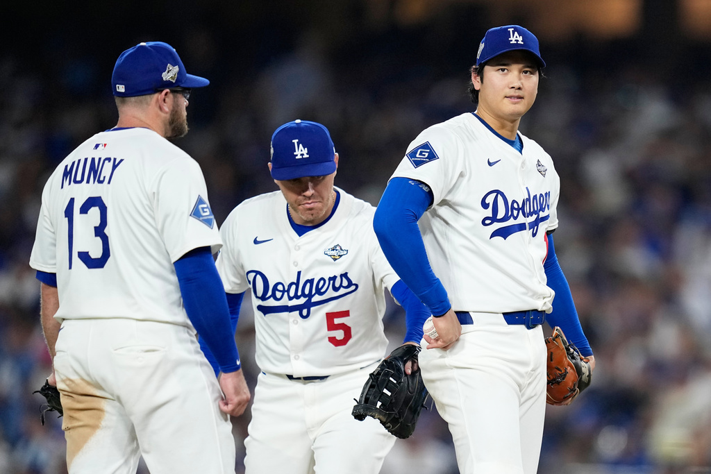 Los Angeles Dodgers pitcher Shohei Ohtani walks to the dugout after leaving the game against the Toronto Blue Jays during the seventh inning in Game 4 of baseball's World Series, Tuesday, Oct. 28, 2025, in Los Angeles. (AP Photo/Brynn Anderson)