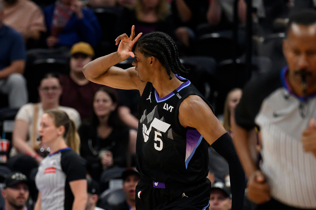 Utah Jazz forward Cody Williams (5) reacts to making a 3-point shot during the first half of an NBA basketball game against the Milwaukee Bucks, Thursday, March 19, 2026, in Salt Lake City. (AP Photo/Tyler Tate)