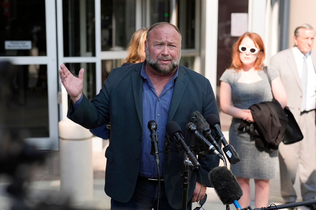 FILE - Right-wing conspiracy theorist Alex Jones speaks outside the federal courthouse after a bankruptcy hearing June 14, 2024, in Houston. (AP Photo/David J. Phillip, File)