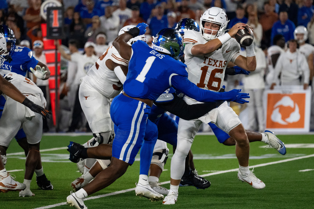 Texas quarterback Arch Manning (16) is sacked in the first quarter of an NCAA college football game against Kentucky, Saturday, Oct. 18, 2025, in Lexington, Ky. (AP Photo/Michael Swensen)
