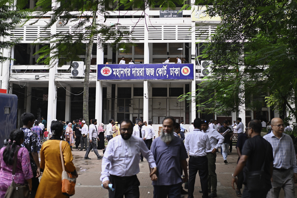 People are seen in the compound of the Metropolitan Sessions Judge Court in Dhaka, Bangladesh, Wednesday, Aug. 13, 2025. (AP Photo/Mahmud Hossain Opu)
