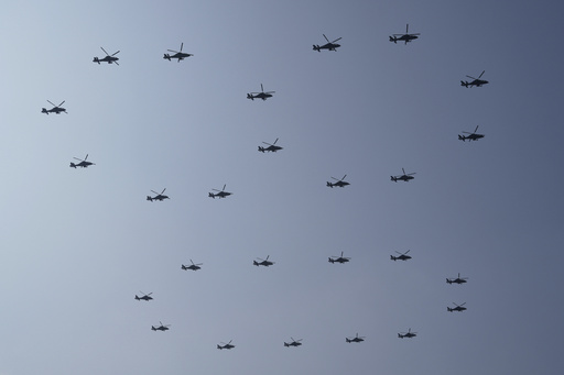 Helicopters fly past during a military parade to commemorate the 80th anniversary of Japan's World War II surrender held in front of Tiananmen Gate in Beijing, Wednesday, Sept. 3, 2025. (AP Photo/Ng Han Guan) Helicopters fly past during a military parade to commemorate the 80th anniversary of Japan's World War II surrender held in front of Tiananmen Gate in Beijing, Wednesday, Sept. 3, 2025. (AP Photo/Ng Han Guan)