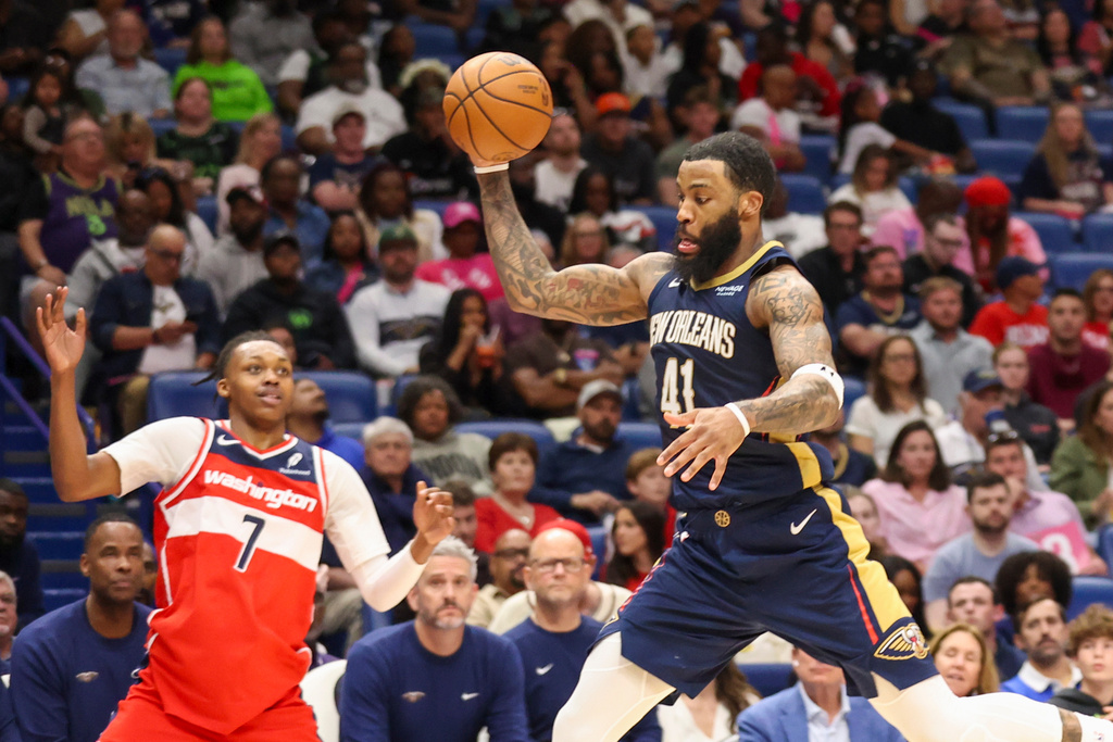 New Orleans Pelicans forward Saddiq Bey (41) intercepts a pass that was intended for Washington Wizards guard Bub Carrington (7) in the second half of an NBA basketball game in New Orleans, Sunday, March 8, 2026. (AP Photo/Peter Forest)