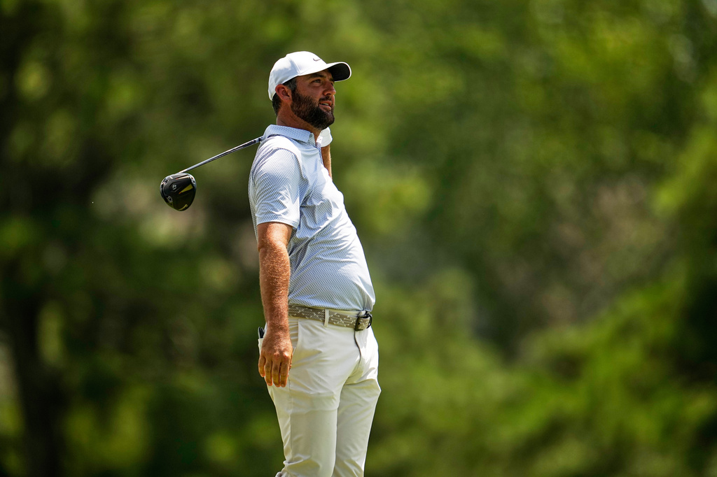 Scottie Scheffler watches his tee shot on the third hole during the third round of the St. Jude Championship golf tournament Saturday, Aug. 15, 2026, in Memphis, Tenn. (AP Photo/George Walker IV)
