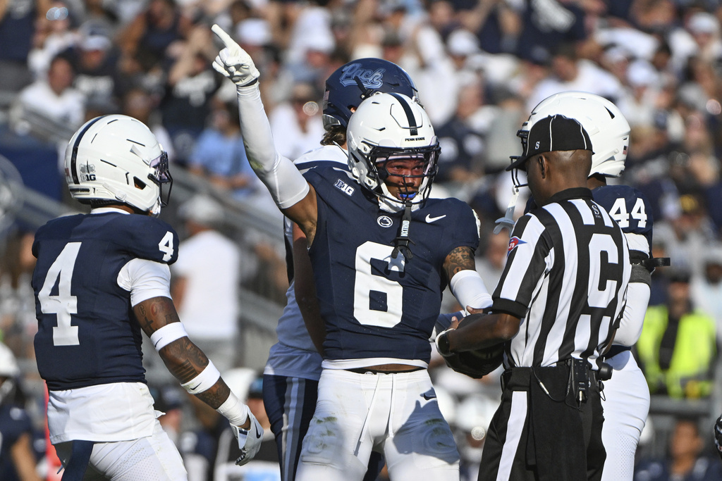 Penn State safety Zakee Wheatley (6) celebrates after recovering a fumble by Nevada running back Herschel Turner (2) during the third quarter of an NCAA college football game, Saturday, Aug. 30, 2025, in State College, Pa. (AP Photo/Barry Reeger)