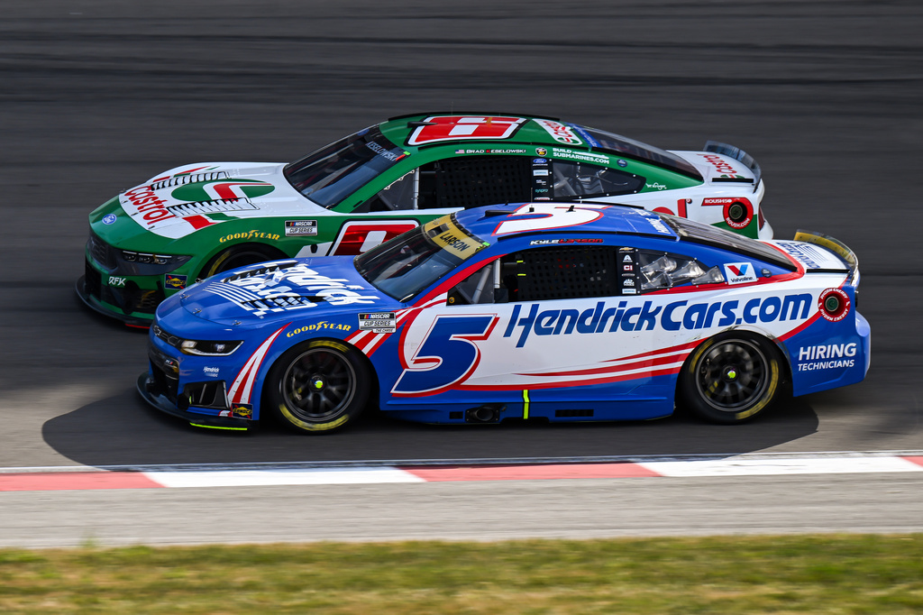 Kyle Larson (5) and Brad Keselowski (6) compete during a NASCAR Cup Series auto race Sunday, Sept. 13, 2026, in Madison, Ill. (AP Photo/Connor Hamilton)