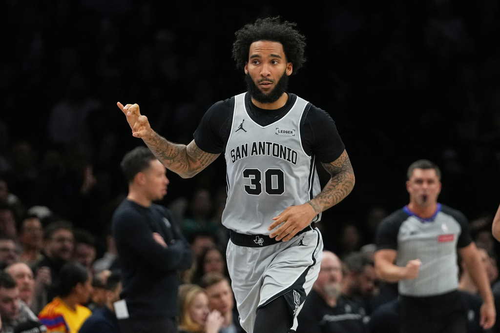 San Antonio Spurs' Julian Champagnie (30) gestures after making a three-point shot during the first half of an NBA basketball game against the Brooklyn Nets Thursday, Feb. 26, 2026, in New York. (AP Photo/Frank Franklin II)