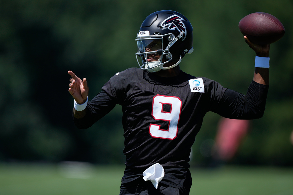 Atlanta Falcons quarterback Michael Penix Jr. (9) runs drills during an NFL football training camp practice Monday, Aug. 24, 2026, in Flowery Branch, Ga. (AP Photo/Brynn Anderson)