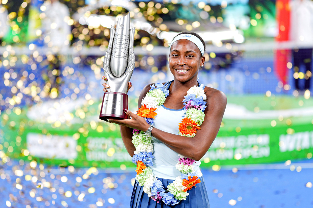 Coco Gauff of the United States celebrates with her trophy after defeating her compatriot Jessica Pegula in the women's singles final at the WTA Wuhan Open in Wuhan in central China's Hubei province Sunday, Oct. 12, 2025. (Chinatopix Via AP) CHINA OUT