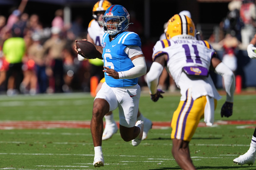 Mississippi quarterback Trinidad Chambliss (6) runs for a first down while pursued by LSU cornerback PJ Woodland (11) during the first half of an NCAA college football game in Oxford, Miss., Saturday, Sept. 27, 2025. (AP Photo/Rogelio V. Solis) Mississippi quarterback Trinidad Chambliss (6) runs for a first down while pursued by LSU cornerback PJ Woodland (11) during the first half of an NCAA college football game in Oxford, Miss., Saturday, Sept. 27, 2025. (AP Photo/Rogelio V. Solis)