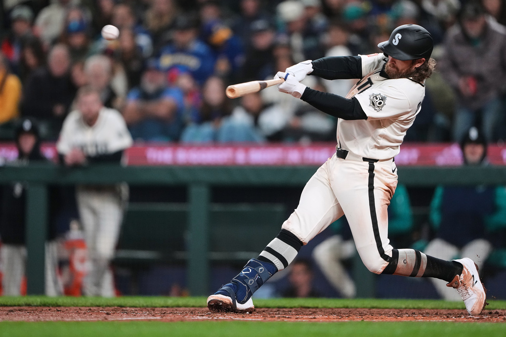 Seattle Mariners' Brendan Donovan hits a three-run home run against the Cleveland Guardians during the fourth inning of a baseball game, Sunday, March 29, 2026, in Seattle. (AP Photo/Lindsey Wasson)