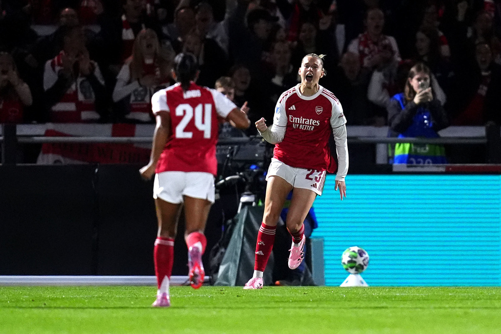 Arsenal's Alessia Russo, right, celebrates scoring their side's first goal the Women's Champions League soccer match between Arsenal and OL Lyonnes at Meadow Park, Borehamwood, England, Tuesday, Oct, 7, 2025. (John Walton/PA via AP)
