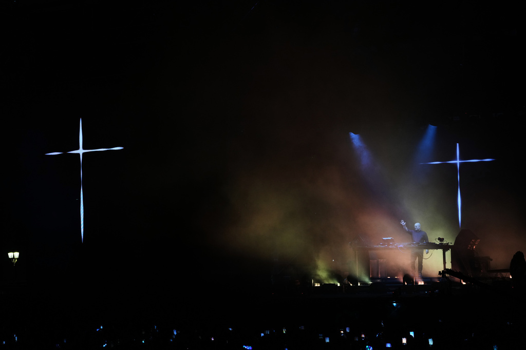 Portuguese Catholic priest, Padre Guilherme performs an open-air DJ set at the Plaza de Mayo, honoring the first year anniversary of Pope Francis' passing in Buenos Aires, Argentina, Saturday, April 18, 2026. (AP Photo/Rodrigo Abd)