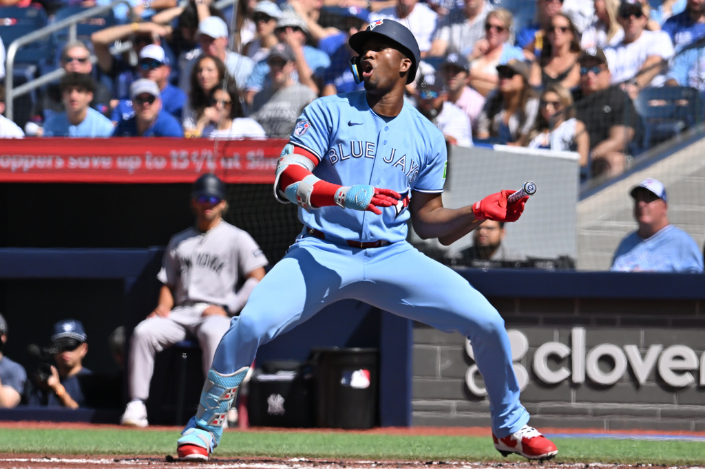 Toronto Blue Jays outfielder Jesus Sanchez (12) reacts to a called strike during the first inning of a baseball game in Toronto, Saturday, Aug. 15, 2026. (Jon Blacker/The Canadian Press via AP)