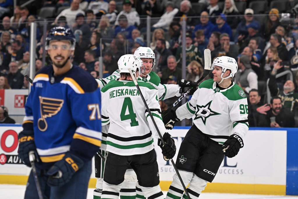 Dallas Stars Thomas Harley (55), center, celebrates with teammates Miro Heiskanen (4) and Mikko Rantanen (96) after scoring against the St. Louis Blues during the third period of an NHL hockey game on Tuesday, Jan. 27, 2026, in St. Louis. (AP Photo/Joe Puetz)