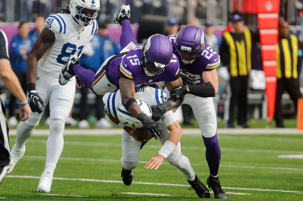 Minnesota Vikings linebacker Dallas Turner (15) sacks Indianapolis Colts quarterback Daniel Jones during the first half of an NFL football game in Minneapolis, Sunday, Oct. 25, 2026. (AP Photo/Bruce Kluckhohn)