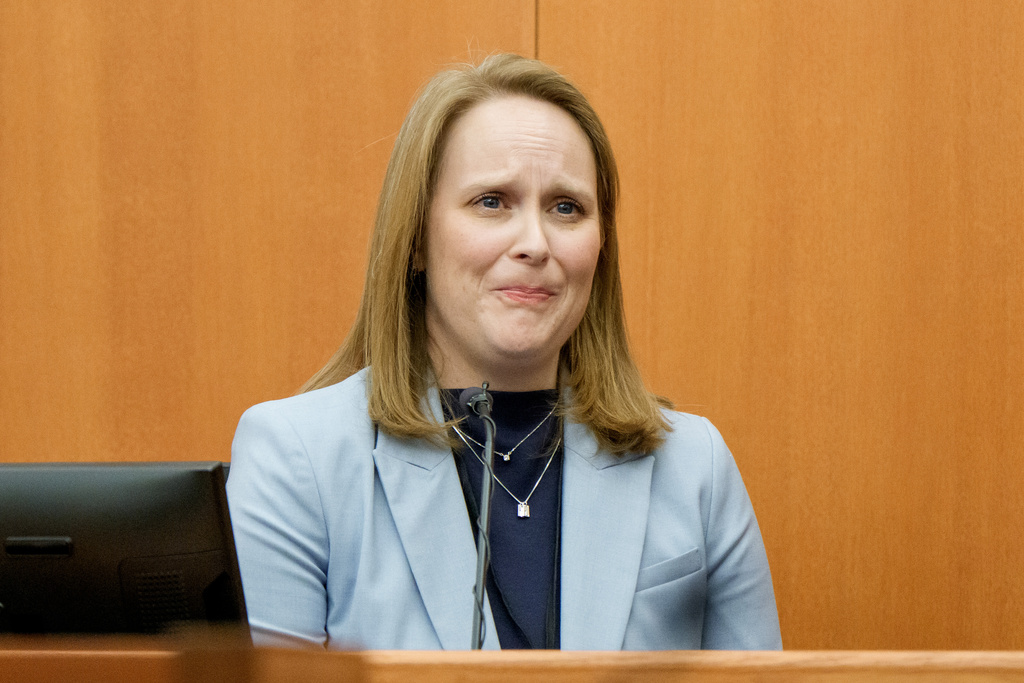 Katie Richins-Benson, the sister of Eric Richins, testifies in the trial of Eric's wife, Kouri Richins, who is accused of fatally poisoning her husband, during her murder trial at the Summit County Courthouse in Park City, Utah, Monday, Feb. 23, 2026. (AP Photo/Spenser Heaps, Pool)