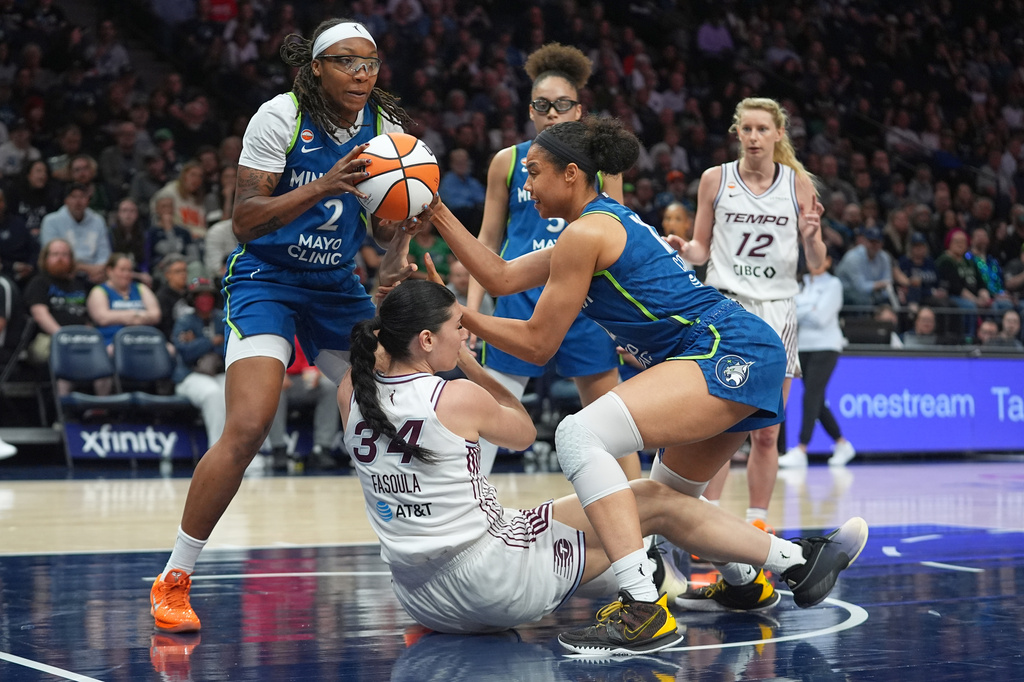 Minnesota Lynx forward Liatu King (2) gains possession of the ball from Toronto Tempo center Mariella Fasoula (34) during the second half of a WNBA basketball game Thursday, May 21, 2026, in Minneapolis. (AP Photo/Abbie Parr)