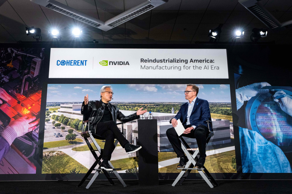 Jensen Huang, left, president and CEO of Nvidia, talks with Jim Anderson, CEO of Coherent, before a groundbreaking ceremony for an expansion of Coherent's manufacturing facility on Tuesday, June 16, 2026, in Sherman, Texas. (AP Photo/Jeffrey McWhorter)