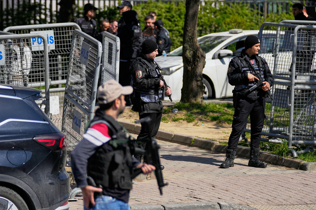 Turkish police secure the area after a gunmen attack at a building housing the Israeli Consulate in Istanbul, Turkey, Tuesday, April 7, 2026. (AP Photo/Khalil Hamra)