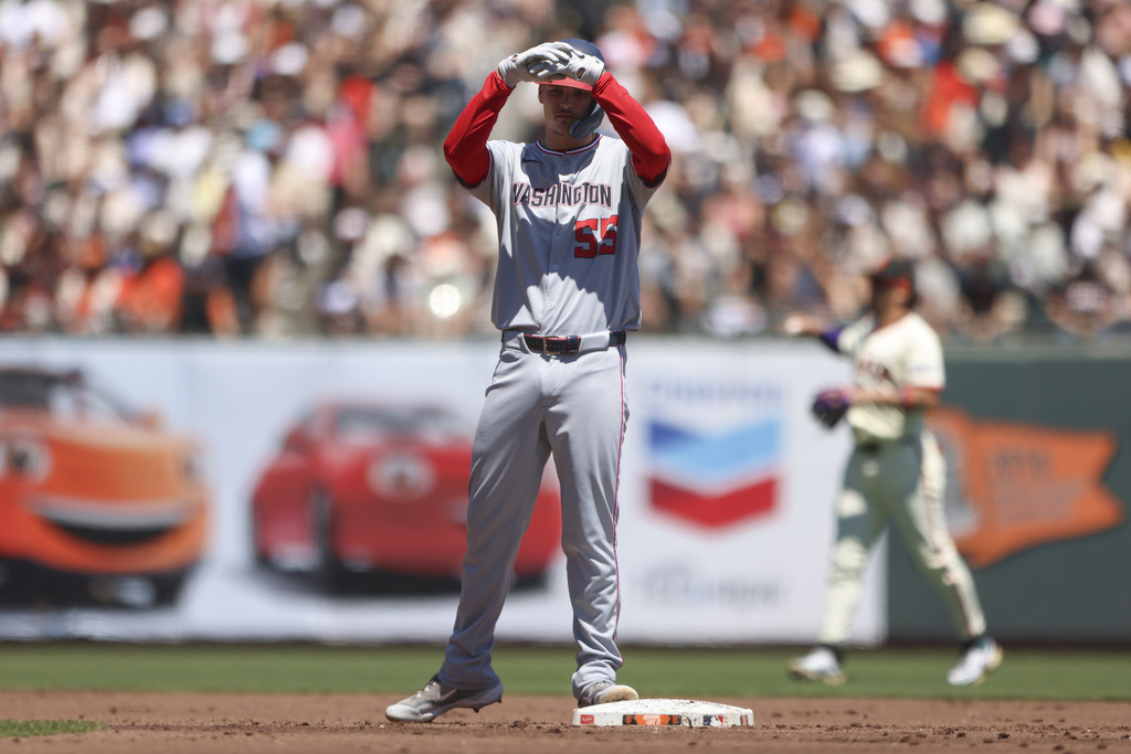 Washington Nationals' Brady House celebrates after his double against the San Francisco Giants during the first inning of a baseball game Saturday, Aug. 9, 2025, in San Francisco. (AP Photo/Scott Marshall)