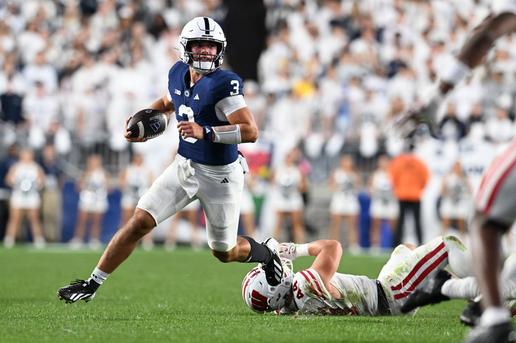 Penn State quarterback Rocco Becht (3) runs from Wisconsin linebacker Cooper Catalano (44) during the third quarter of an NCAA college football game, Saturday, Sept. 26, 2026, in State College, Pa. (AP Photo/Barry Reeger)