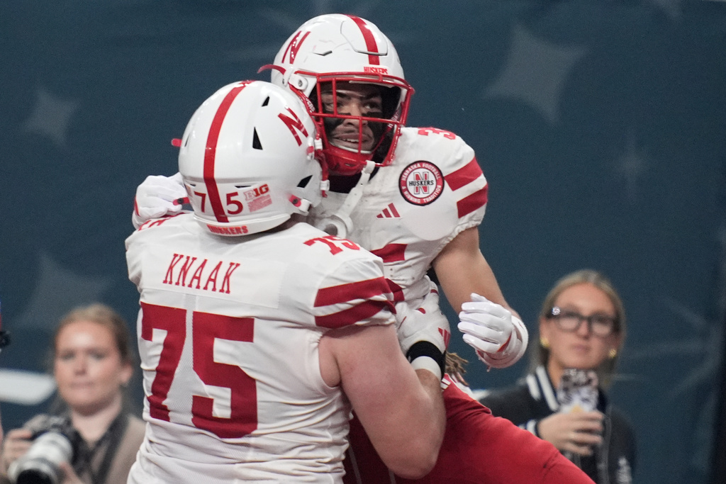 Nebraska running back Mekhi Nelson, right, celebrates after scoring a touchdown against Utah during the first half of the Las Vegas Bowl NCAA college football game Wednesday, Dec. 31, 2025, in Las Vegas. (AP Photo/John Locher)